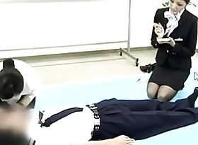 Japanese Stewardess Demonstrates Proper CPR Procedures