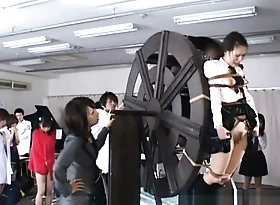 japanese schoolgirls punished on waterwheel